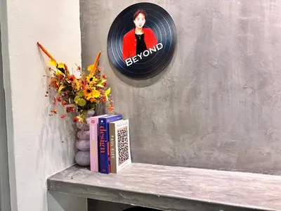 a shelf with a book and a clock on a wall at CornerDouble-Storey&KTV Snooker 16Pax Ipoh By MICASA GROUP in Ipoh