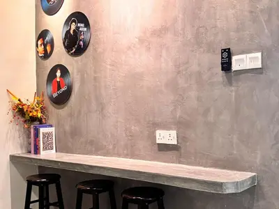 a bar with stools and plates on a wall at CornerDouble-Storey&KTV Snooker 16Pax Ipoh By MICASA GROUP in Ipoh