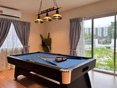a pool table in a living room with a pool table at CornerDouble-Storey&KTV Snooker 16Pax Ipoh By MICASA GROUP in Ipoh