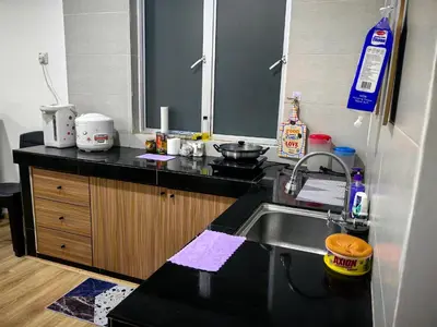 a kitchen with a sink and a counter top at KAZ homestay in Tanah Rata