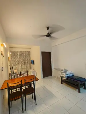 a living room with a table and chairs and a couch at SZ Homestay Near KPJ Hospital in Kampong Permatang Batu