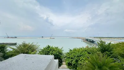 a view of a large body of water with a dock at Straits Quay Seaview in Tanjung Bungah