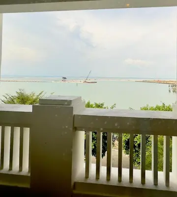 a view of the ocean from a balcony at Straits Quay Seaview in Tanjung Bungah