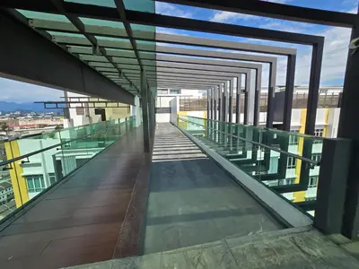 a glass walkway on top of a building at The Majestic Privilege Suites - Ipoh in Ipoh