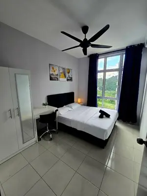 a bedroom with a bed and a ceiling fan at b09 The Anderson Ipoh Family Stay 2BR in Ipoh