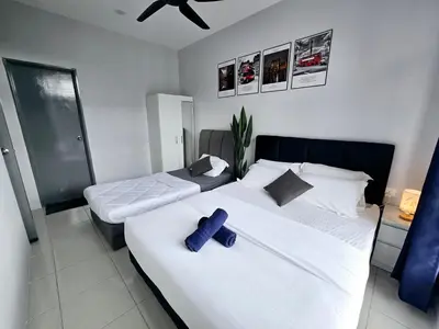 a bedroom with two beds and a ceiling fan at b09 The Anderson Ipoh Family Stay 2BR in Ipoh