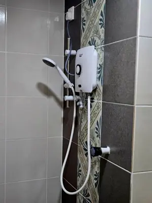 a shower in a bathroom with a hair dryer at b09 The Anderson Ipoh Family Stay 2BR in Ipoh