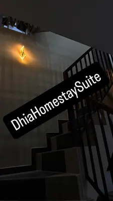 a sign for the dhanotechnology shuttle on a building at Homestay Suite Kuala Ketil in Kuala Ketil