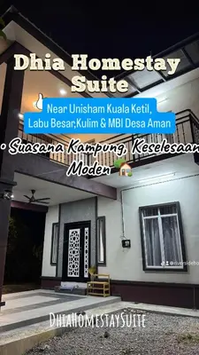 a sign on the side of a building at Homestay Suite Kuala Ketil in Kuala Ketil
