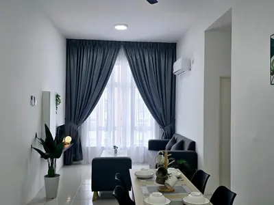 a living room with a table and chairs and a window at d05 The Anderson Ipoh Family Stay 2BR in Ipoh
