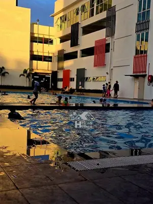 a group of people playing in a pool of water at c06 The Anderson Ipoh Family Stay 2BR in Ipoh