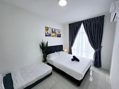 a bedroom with two beds and a window at c06 The Anderson Ipoh Family Stay 2BR in Ipoh