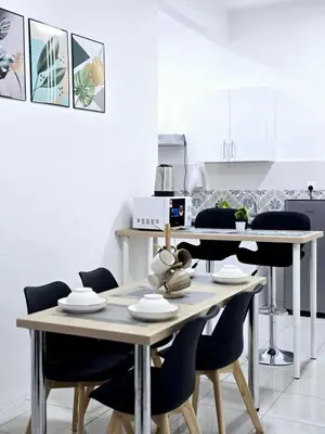 a dining room with a table and chairs at d10 The Anderson Ipoh Family Stay 2BR in Ipoh