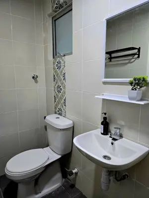 a bathroom with a toilet and a sink at b07 The Anderson Ipoh Family Stay 2BR in Ipoh