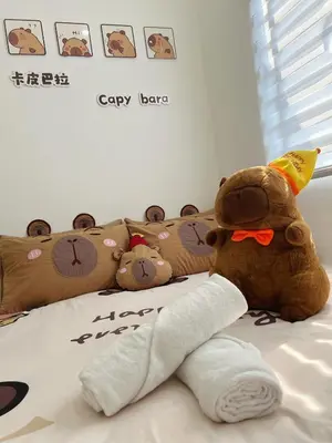 a stuffed teddy bear sitting on top of a bed at BM Alma Aeonjusco Auto City Homestay in Bukit Mertajam
