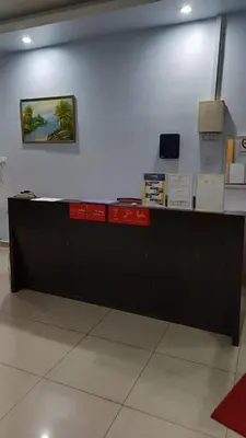 a long counter in a room with at JJ Hotel Sitiawan Perak in Sitiawan