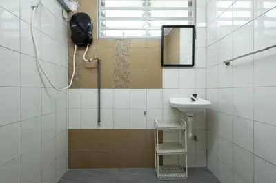 a bathroom with a sink and a mirror at Casa Celia - Pet allowed private parking studio in Ipoh