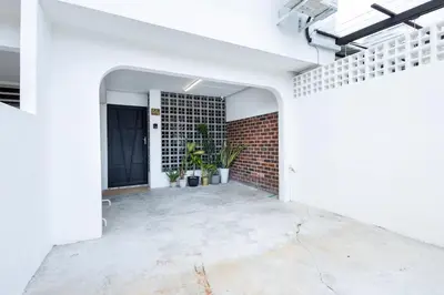 an empty room with white walls and a brick wall at Casa Celia - Pet allowed private parking studio in Ipoh