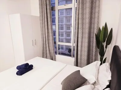 a room with a white table and a window at b04 The Anderson Ipoh Family Stay 2BR in Ipoh