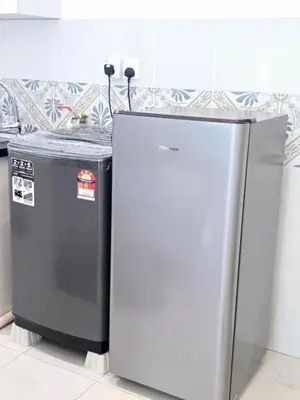 two refrigerators sitting next to each other in a kitchen at c02 The Anderson Ipoh Family Stay 2BR in Ipoh