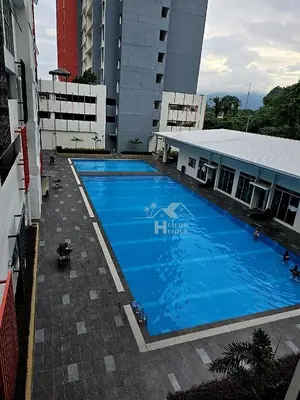 a large blue swimming pool in front of a building at c02 The Anderson Ipoh Family Stay 2BR in Ipoh