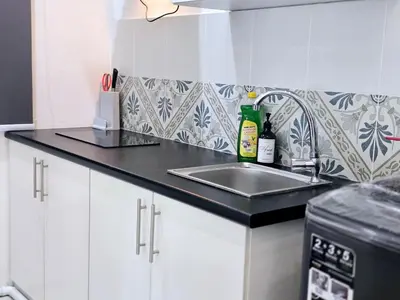 a kitchen with a sink and a counter top at c02 The Anderson Ipoh Family Stay 2BR in Ipoh