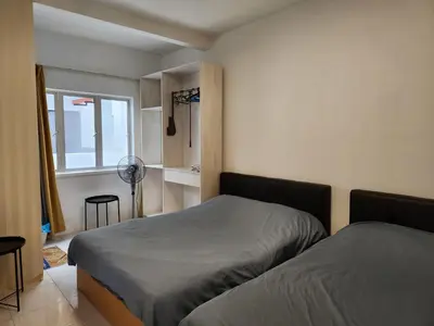 a bedroom with two beds and a window at Cameron Highland 915 Glamping Style 3BR 10 Pax in Brinchang