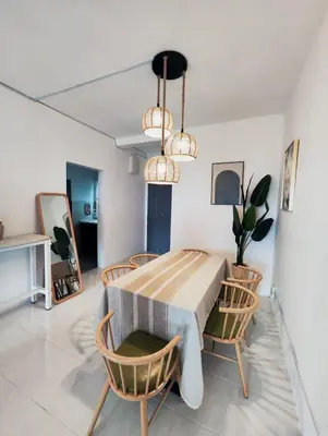 a dining room with a table and chairs at Cameron Highland 915 Glamping Style 3BR 10 Pax in Brinchang