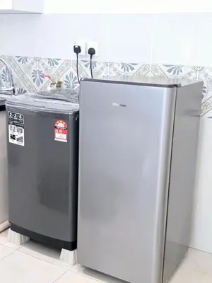 two refrigerators sitting next to each other in a kitchen at c04 The Anderson Ipoh Family Stay 2BR in Ipoh