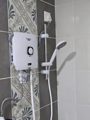a shower in a bathroom with a shower head at c04 The Anderson Ipoh Family Stay 2BR in Ipoh