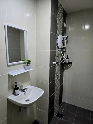 a bathroom with a sink and a mirror at a06 The Anderson Ipoh Family Stay 2BR in Ipoh