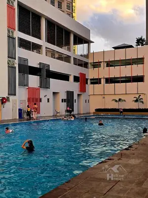 a group of people swimming in a swimming pool at a06 The Anderson Ipoh Family Stay 2BR in Ipoh