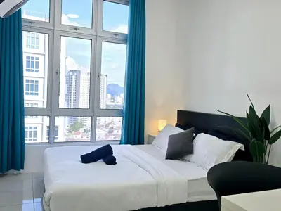 a bedroom with a large bed with a large window at a06 The Anderson Ipoh Family Stay 2BR in Ipoh