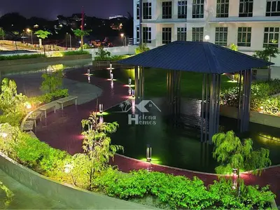 a building with a gazebo next to a river at night at d01 The Anderson Ipoh Family Stay 2BR in Ipoh