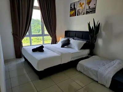 a bedroom with two beds and a window at d02 The Anderson Ipoh Family Stay 2BR in Ipoh
