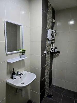 a bathroom with a sink and a mirror at d02 The Anderson Ipoh Family Stay 2BR in Ipoh