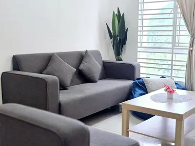 a living room with a couch and a table at b03 The Anderson Ipoh Family Stay 2BR in Ipoh