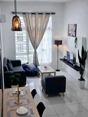 a living room with a couch and a table at b03 The Anderson Ipoh Family Stay 2BR in Ipoh