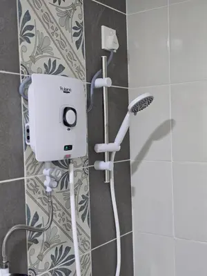 a shower in a bathroom with a shower head at b06 The Anderson Ipoh Family Stay 2BR in Ipoh