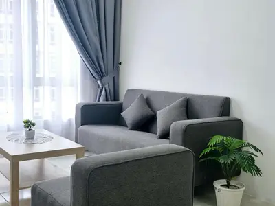 a living room with a couch and a table at a04 The Anderson Ipoh Family Stay 2BR in Ipoh