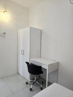 a white desk and a chair in a room at b02 The Anderson Ipoh Family Stay 2BR in Ipoh