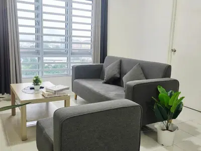 a living room with a couch and a table at d09 The Anderson Ipoh Family Stay 2BR in Ipoh