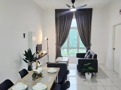 a living room with a table and chairs and a window at d15 The Anderson Ipoh Family Stay 2BR in Ipoh