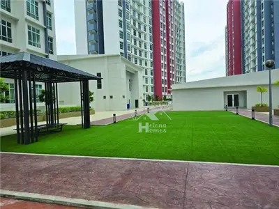 a large green field in front of a building at b05 The Anderson Ipoh Family Stay 2BR in Ipoh