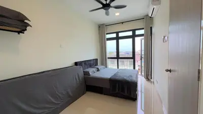 a bedroom with a bed and a large window at Ether 665 Homestay in Sekincan