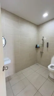 a bathroom with a toilet and a sink at Ether 665 Homestay in Sekincan