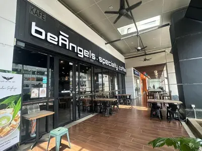 a restaurant with tables and chairs in a building at Wonderful Seaview Studio 4Pax 118 Island Plaza in George Town