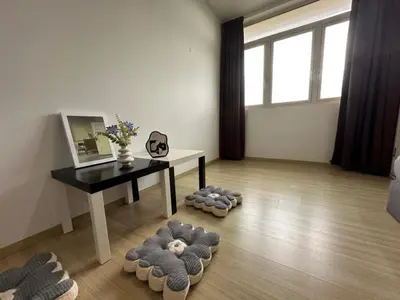 a living room with a table and some teddy bears on the floor at Wonderful Seaview Studio 4Pax 118 Island Plaza in George Town