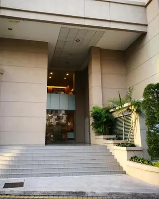 a building with stairs in front of a building at Wonderful Seaview Studio 4Pax 118 Island Plaza in George Town