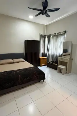a bedroom with a bed and a ceiling fan at AYAAN SOCCER HOME at Quintet Apartment with Free Parking in Tanah Rata